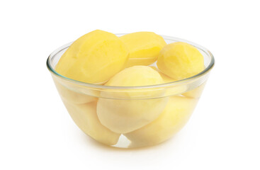 Peeled potatoes in a glass bowl isolated on white