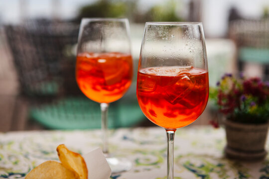 Italian Traditional Food And Aperitif In The Northern Italy, Lombardy, Milan. Two Glasses Of An Alcoholic Cocktail 