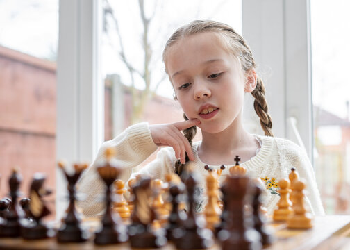 Kids Early Development. Pupil Kid Thinking about His Next Move in a Game of  Chess. Stock Image - Image of child, chess: 172839087