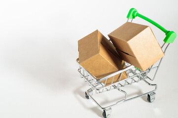 Shopping trolley with paper brown carton boxes