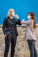 Two Friends in Business Outfit Meet and Do Elbow Greeting, Safe Handshake