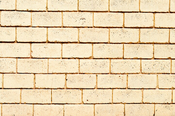 Texture of a brick wall with cracks and scratches which can be used as a background