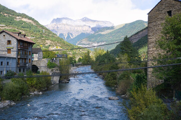 the Ara river as it passes through the town of Broto, in the Aragonese Pyrenees, located in Huesca,...