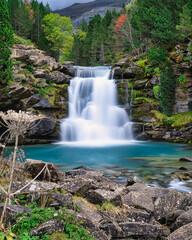 Fototapeta na wymiar Gradas de Soaso waterfall in Ordesa y Monte Perdido National Park, in the Aragonese Pyrenees, located in Huesca, Spain.