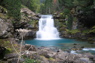 Obraz premium Gradas de Soaso waterfall in Ordesa y Monte Perdido National Park, in the Aragonese Pyrenees, located in Huesca, Spain.