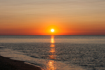 Seascape after sunrise with reflection of the sun track