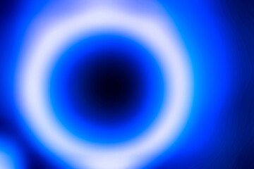 Blue and white circles forming a blurred motion abstract textured background