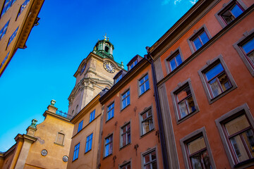 Looking up at the Steeple of the German Church and the Surrounding Buildings in the Gamla Stan Neighborhood of Stockholm, Sweden