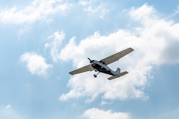 Ground view of a small plane flying