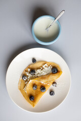 breakfast with pancakes and cottage cheese and berries