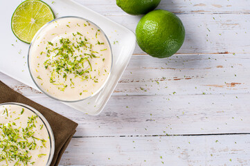 .Delicious lemon mousse. Refreshing and tasty dessert - Lime mousse. Top view. Copy space