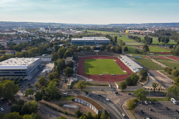 Aerial view of a football field stadium in dresden wioth green fields in the background