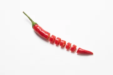 Keuken spatwand met foto Slice of red hot little chili pepper pattern isolated on white background © zhikun sun