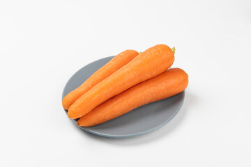 Fresh carrots isolated on white background