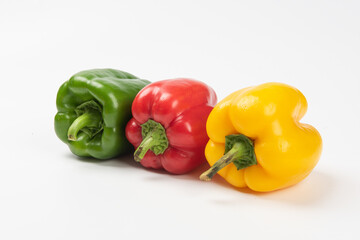 Fresh ripe color peppers isolated on white background