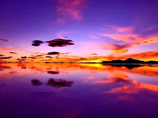 Peel and stick wall murals Violet Magical sunrise sky over mysterious lake in desert. Incredible heaven clouds reflection in water. Surreal fantasy landscape alike alien planet.