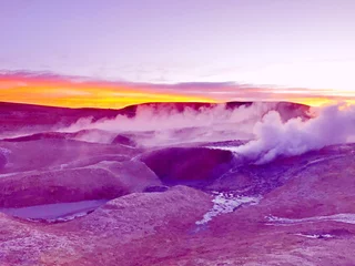 Surreal alien landscape Geothermal valley Salar de Manana in Bolivia. Smoking geysers, fumaroles at sunrise light, incredible volcanic nature.