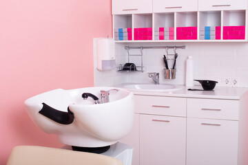Naklejka na ściany i meble Color bar with sink and working tools in hairdressing salon