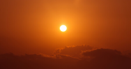 dark sky with sun and cloud