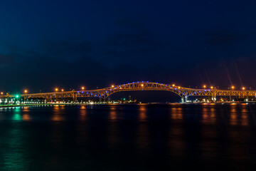 Blue Water Bridge At Night Lights Up The St. Clair River Waterfront