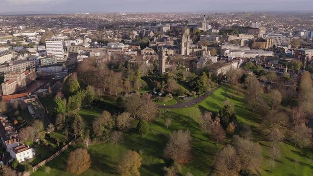 Bristol aerial cityscape heading towards the centre and University of Bristol over Brandon Hill and Cabot Tower