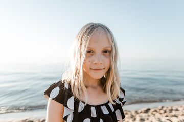 Portrait of a girl at the beach looking at the camera