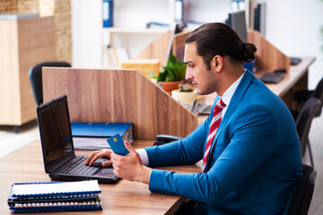 Young male employee working in the office