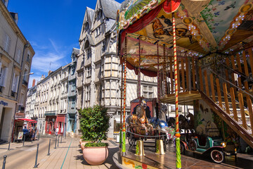 Obraz na płótnie Canvas Carousel in a Place Sainte-Croix square in downtown of Angers in France