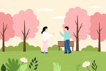 Naklejka na ściany i meble Man and woman who meet and talk in the park.
