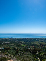 Panoramic view of Montecito, Pacific Ocean and Channel Islands from Old Romero Canyon Trail in Montecito, California near Santa Barbara  on a clear, sunny spring day