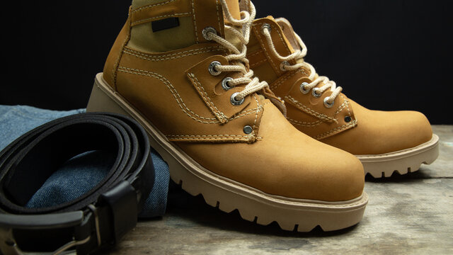 mustard colored boots and jeans with work or fashion style