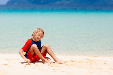 Kids playing on beach. Children play at sea.