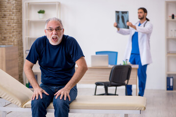 Old male patient visiting young male doctor radiologist