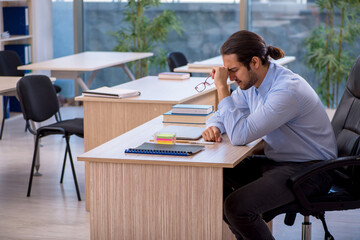 Young male teacher in the classroom