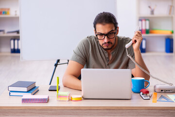 Young male designer working in the office