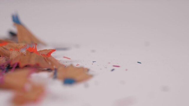 Color Pencil Shavings Falling On White Background