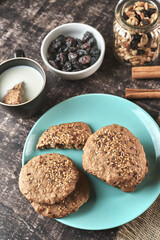 Healthy oat and flaxseed cookies in dark wood with your healthy ingredients for breakfast or snacks
