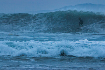 Surfing at Rincon point in California in winter