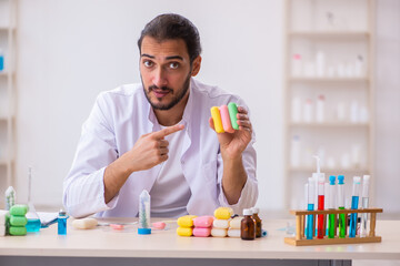 Young male chemist testing soap in the lab