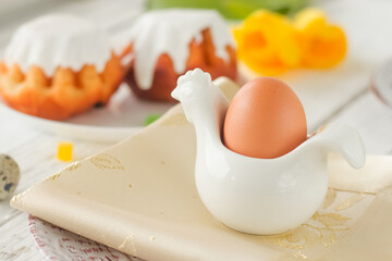 Easter. An easter egg in a stand on a festive table.