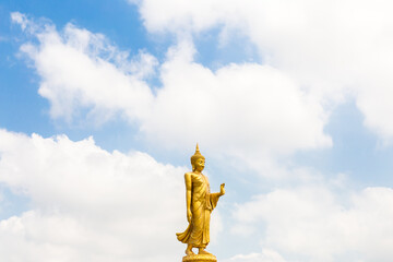 The standing buddha with blue sky and cloud,Copy space