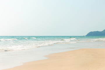 Fototapeta na wymiar Tropical beach view,Sea waves seamless loop on the beautiful sand beach.