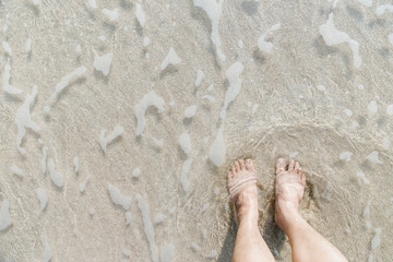 Feet on sea sand , Vacation on ocean beach