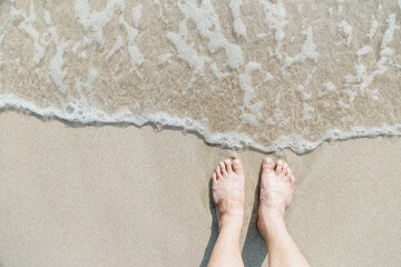 Feet on sea sand , Vacation on ocean beach