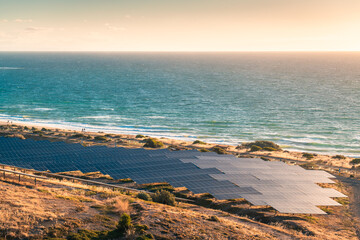 Fototapeta na wymiar Solar panels installed along the coastline at sunset in South Australia