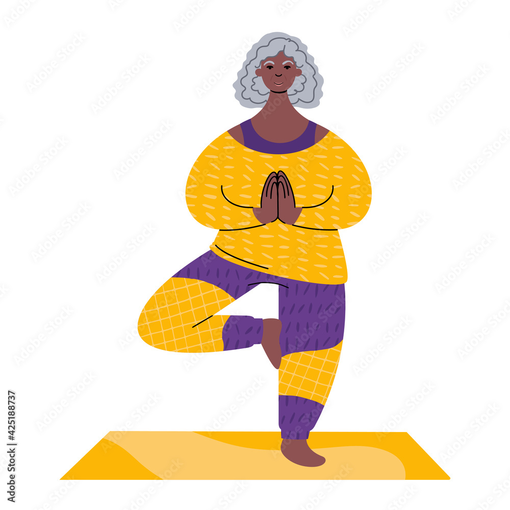 Wall mural practicing yoga. senior african woman standing in a tree pose.