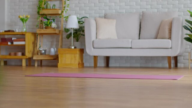 yoga mat in living room ready to excercise with yoga