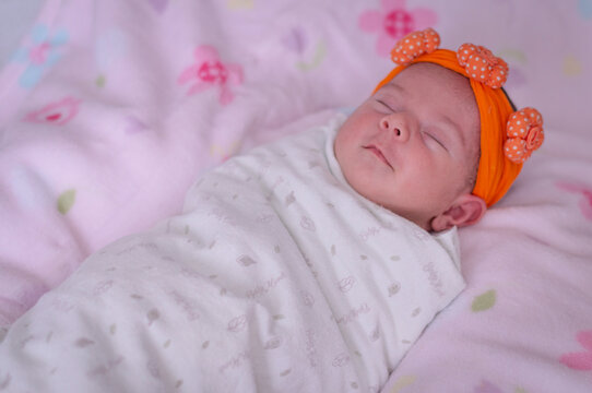 baby wrapped using a soft swaddle. Sleeping.
