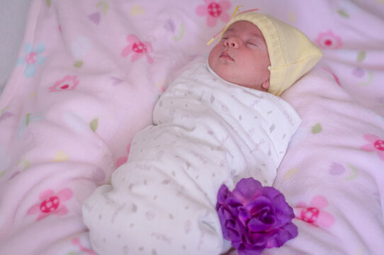 baby wrapped using a soft swaddle. Sleeping.
