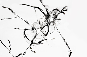 Cracked broken glass, the texture of cracked windshield from a stone blow or a bullet shot